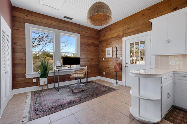 2124 Bluebonnet Ln, Austin, TX 78704 - office space with wood walls, light tile patterned floors, and attic access
