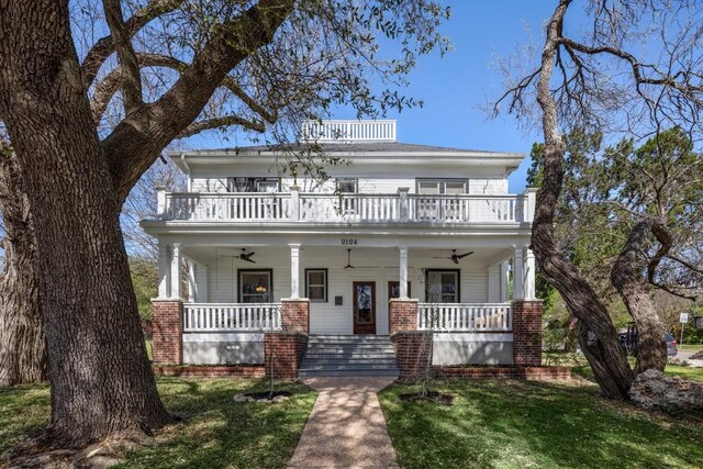 2124 Bluebonnet Ln, Austin, TX 78704 - traditional style home with a balcony, covered porch, ceiling fan, and a front yard
