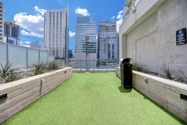 222 W Ave Unit 1213, Austin, TX 78701 - view of yard with a view of skyline and a balcony
