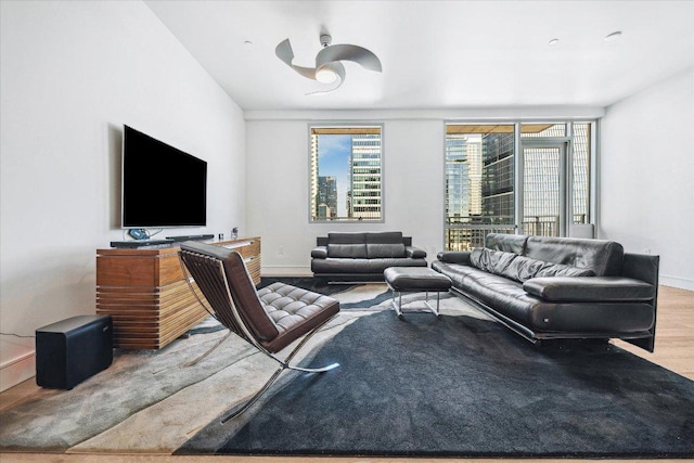 222 W Ave Unit 1213, Austin, TX 78701 - living room featuring wood finished floors and baseboards