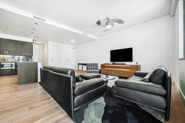 222 W Ave Unit 1213, Austin, TX 78701 - living area featuring light wood-style floors