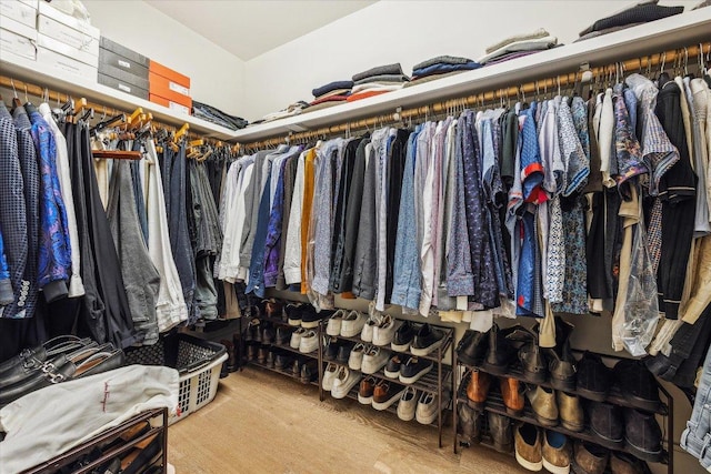 222 W Ave Unit 1213, Austin, TX 78701 - walk in closet with wood finished floors