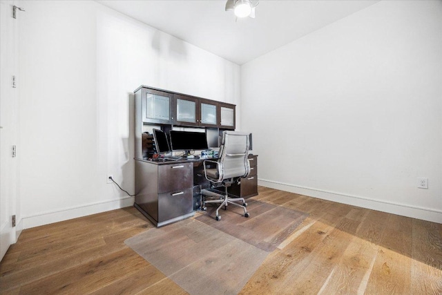 222 W Ave Unit 1213, Austin, TX 78701 - home office featuring wood finished floors, baseboards, and ceiling fan