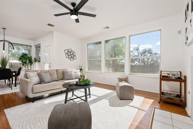 2126 Simbrah Dr, Cedar Park, TX 78613 - living area featuring light wood-type flooring, a ceiling fan, and baseboards