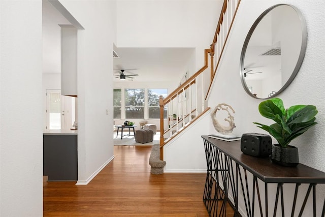 2126 Simbrah Dr, Cedar Park, TX 78613 - entrance foyer with wood finished floors, a ceiling fan, stairs, and baseboards