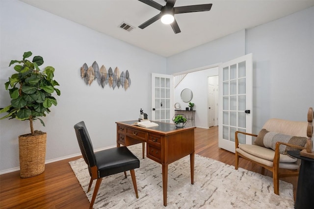 2126 Simbrah Dr, Cedar Park, TX 78613 - home office featuring french doors, a ceiling fan, wood finished floors, and baseboards