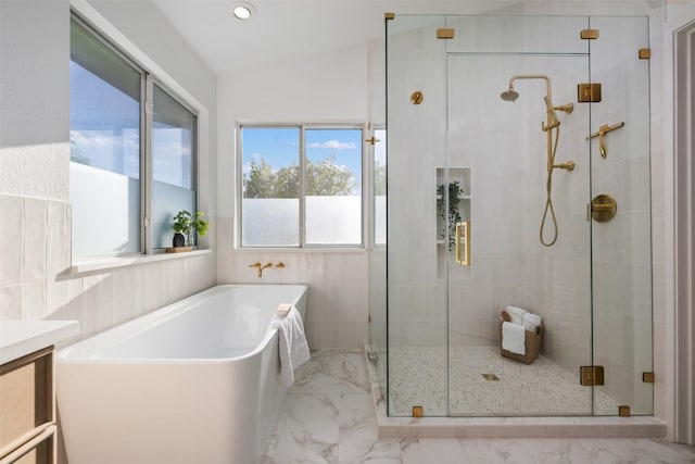2126 Simbrah Dr, Cedar Park, TX 78613 - full bathroom with marble finish floors, a soaking tub, a shower stall, vanity, and vaulted ceiling