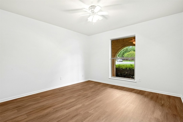 1304 Knollwood Cv, Round Rock, TX 78681 - spare room featuring wood finished floors, a ceiling fan, and baseboards