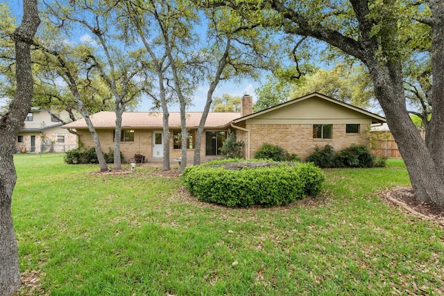 1304 Knollwood Cv, Round Rock, TX 78681 - back of property with a chimney and brick siding