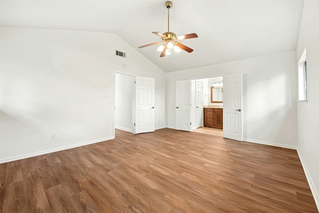 1304 Knollwood Cv, Round Rock, TX 78681 - unfurnished bedroom with baseboards, light wood-style floors, ensuite bathroom, and high vaulted ceiling