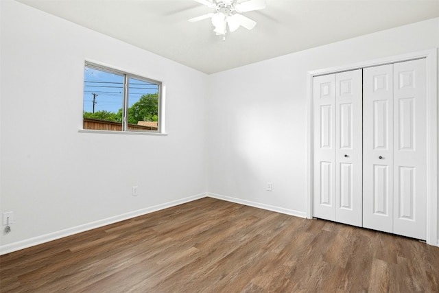 1304 Knollwood Cv, Round Rock, TX 78681 - unfurnished bedroom with wood finished floors, baseboards, a closet, and ceiling fan
