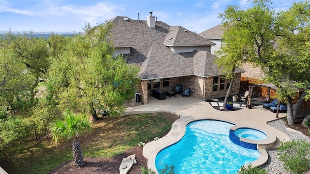 5621 Cypress Ranch Blvd, Spicewood, TX 78669 - view of pool with a pool with connected hot tub, a fenced backyard, a patio, and an outdoor living space