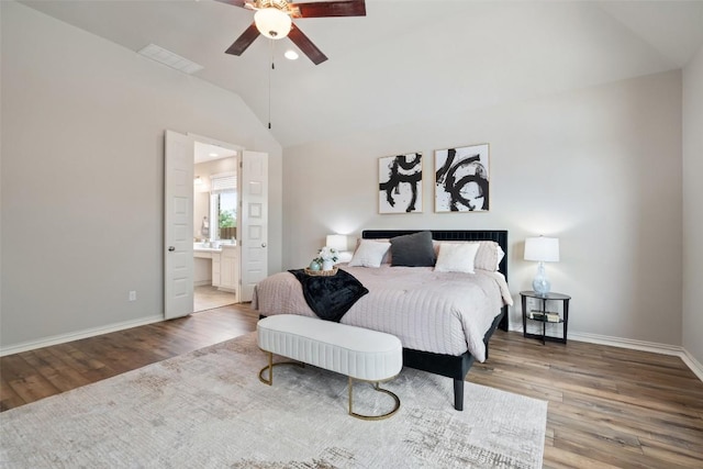 5621 Cypress Ranch Blvd, Spicewood, TX 78669 - bedroom featuring vaulted ceiling, wood finished floors, ensuite bath, ceiling fan, and recessed lighting