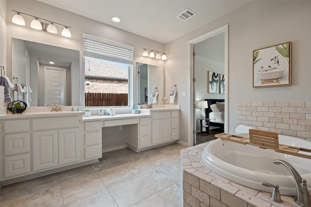5621 Cypress Ranch Blvd, Spicewood, TX 78669 - ensuite bathroom with double vanity and a bath