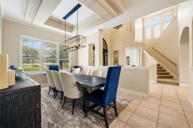 4321 Lakeway Blvd, Austin, TX 78734 - dining space featuring a chandelier, light tile patterned floors, stairway, and a raised ceiling
