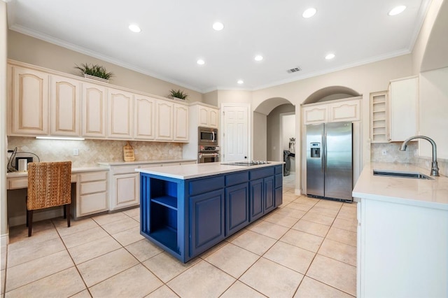 4321 Lakeway Blvd, Austin, TX 78734 - kitchen featuring appliances with stainless steel finishes, blue cabinets, light tile patterned floors, a center island, and recessed lighting