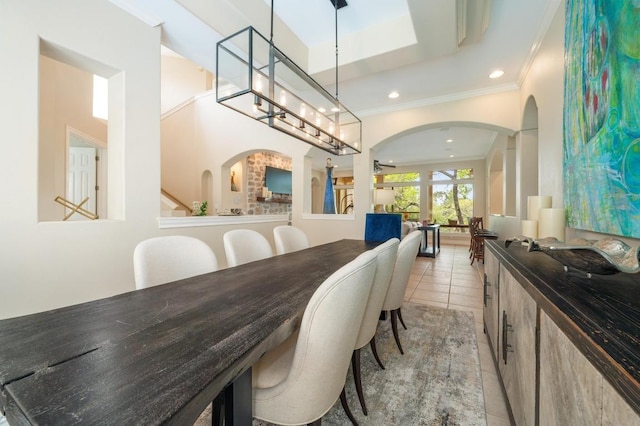 4321 Lakeway Blvd, Austin, TX 78734 - dining area with arched walkways, crown molding, light tile patterned floors, and recessed lighting