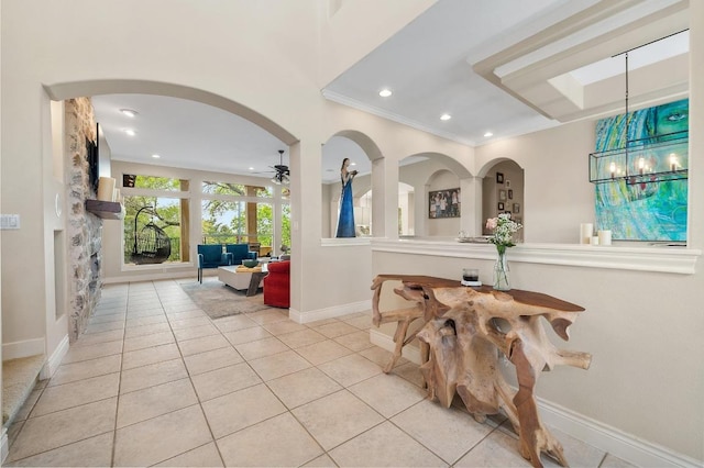 4321 Lakeway Blvd, Austin, TX 78734 - foyer with light tile patterned floors, recessed lighting, crown molding, a ceiling fan, and arched walkways