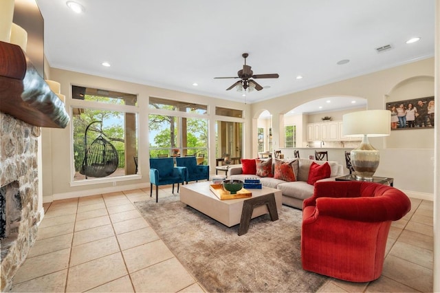 4321 Lakeway Blvd, Austin, TX 78734 - tiled living area with ornamental molding, a ceiling fan, recessed lighting, and arched walkways