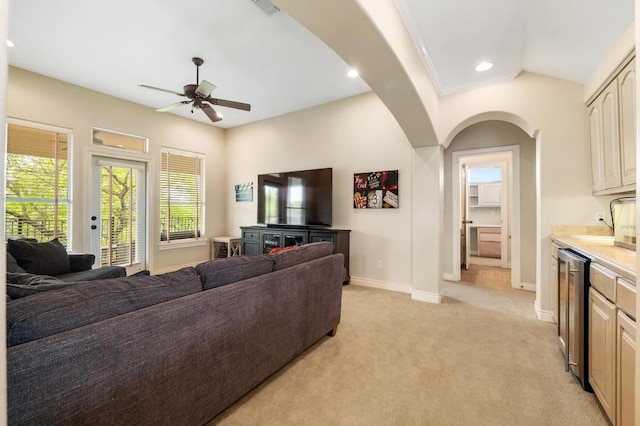 4321 Lakeway Blvd, Austin, TX 78734 - living area featuring ceiling fan, light colored carpet, arched walkways, recessed lighting, and beverage cooler