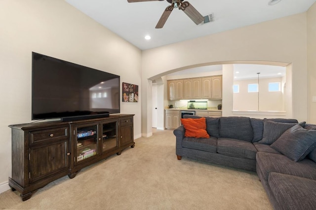 4321 Lakeway Blvd, Austin, TX 78734 - living room with light colored carpet, ceiling fan, arched walkways, bar area, and recessed lighting