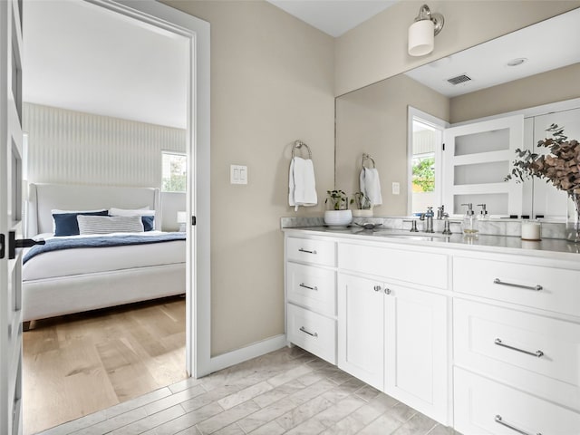 1004 Maufrais St, Austin, TX 78703 - ensuite bathroom with vanity and baseboards