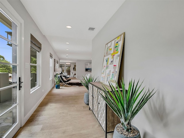 1004 Maufrais St, Austin, TX 78703 - hallway featuring plenty of natural light, light wood finished floors, and recessed lighting