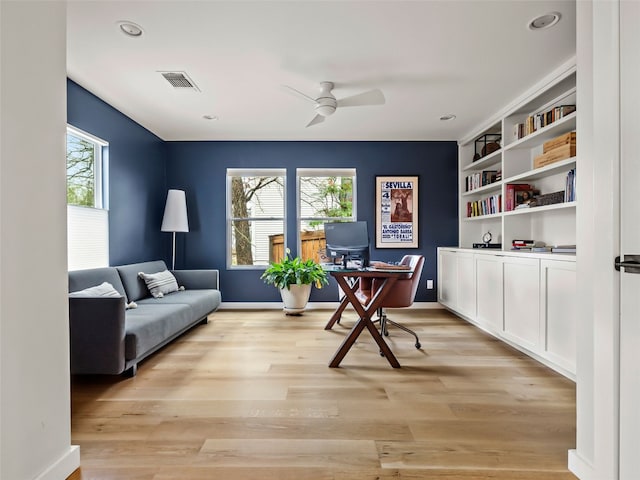 home office with recessed lighting, visible vents, a ceiling fan, light wood-style floors, and baseboards