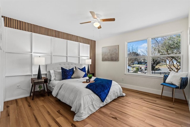 6303 Bexton Cir, Austin, TX 78745 - bedroom with baseboards, wood finished floors, and a ceiling fan
