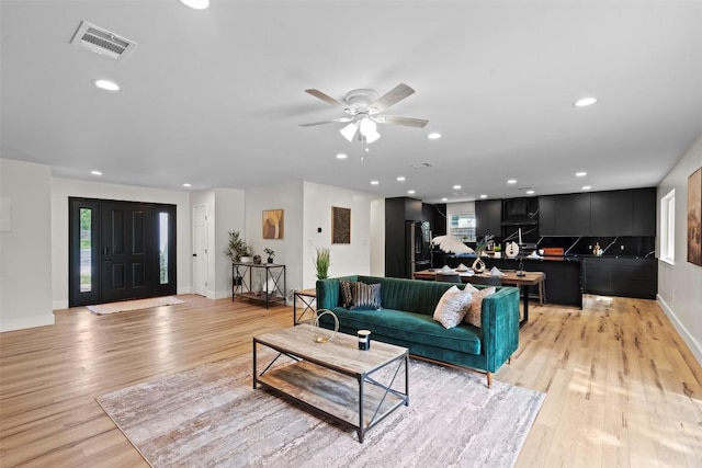 6303 Bexton Cir, Austin, TX 78745 - living area featuring plenty of natural light, light wood-style flooring, a ceiling fan, baseboards, and recessed lighting