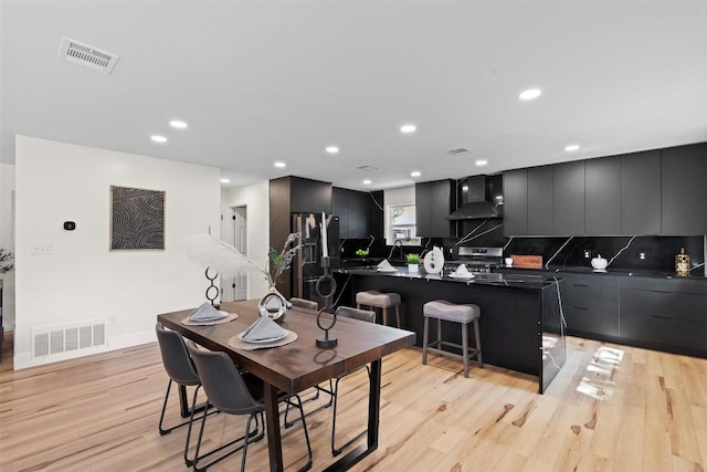 6303 Bexton Cir, Austin, TX 78745 - dining area featuring light wood-style floors and recessed lighting
