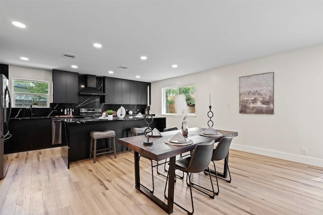6303 Bexton Cir, Austin, TX 78745 - dining area featuring light wood-style floors, plenty of natural light, and recessed lighting