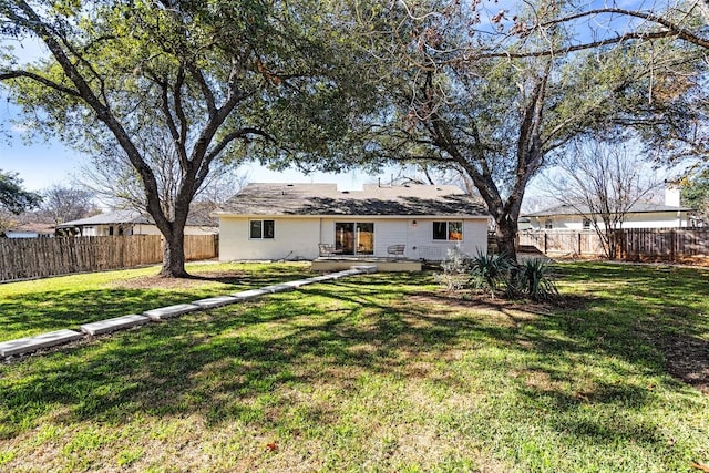 6303 Bexton Cir, Austin, TX 78745 - back of property with a fenced backyard and a patio