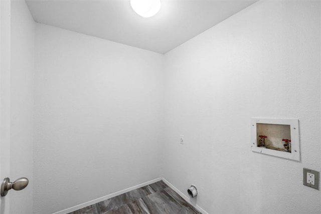 906 E Village Ln, Austin, TX 78758 - washroom with hookup for a washing machine and dark wood-style floors