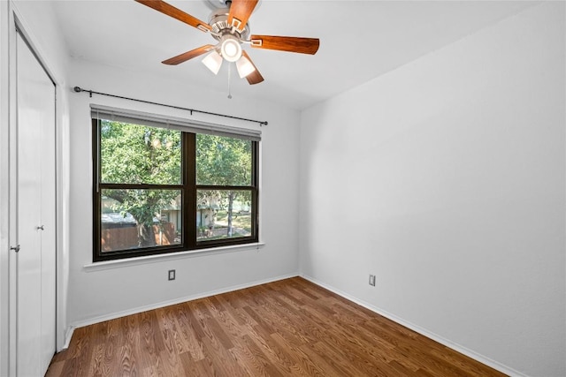 906 E Village Ln, Austin, TX 78758 - unfurnished bedroom featuring wood finished floors, a closet, and ceiling fan
