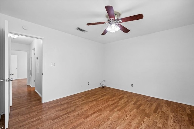 906 E Village Ln, Austin, TX 78758 - spare room featuring a ceiling fan and wood finished floors