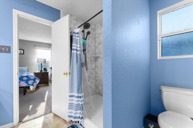 ensuite bathroom with a shower with shower curtain, ensuite bathroom, and a healthy amount of sunlight