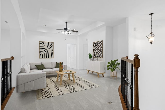15408 Prestancia Dr, Austin, TX 78717 - living area featuring a tray ceiling, a ceiling fan, and carpet