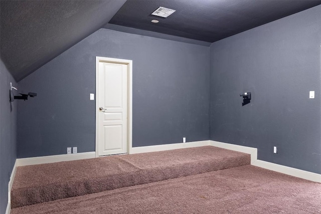 15408 Prestancia Dr, Austin, TX 78717 - additional living space with vaulted ceiling and carpet flooring