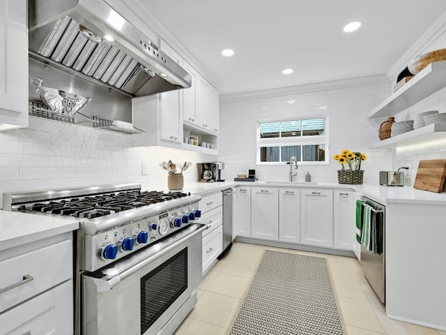 2610 Jefferson St, Austin, TX 78703 - kitchen with stainless steel appliances, open shelves, wall chimney exhaust hood, backsplash, and white cabinetry