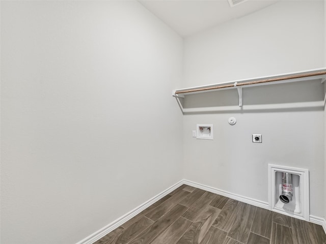 clothes washing area featuring wood tiled floor, laundry area, hookup for an electric dryer, hookup for a gas dryer, and washer hookup