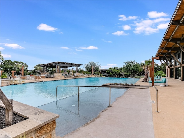 community pool with a pergola and a patio