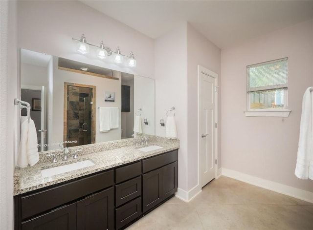 17504 Village Dr, Dripping Springs, TX 78620 - bathroom featuring double vanity, a shower stall, baseboards, and tile patterned flooring