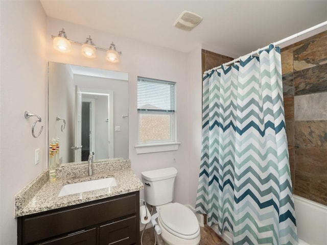 17504 Village Dr, Dripping Springs, TX 78620 - full bath featuring vanity, toilet, and shower / bathtub combination with curtain