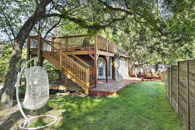 512 Bouldin Ave, Austin, TX 78704 - fenced backyard with a wooden deck and stairs