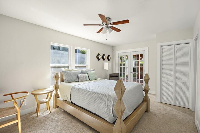 512 Bouldin Ave, Austin, TX 78704 - bedroom with french doors, multiple windows, light colored carpet, and a closet