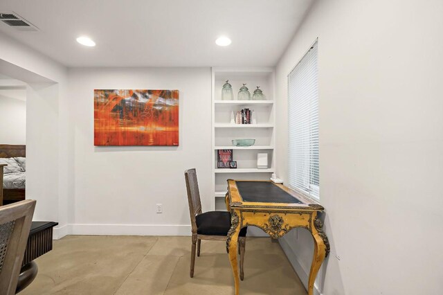 512 Bouldin Ave, Austin, TX 78704 - home office featuring concrete floors, recessed lighting, and built in shelves