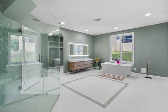 2305 Barton Creek Blvd Unit 36, Austin, TX 78735 - full bath featuring vanity, recessed lighting, a freestanding tub, a shower stall, and baseboards