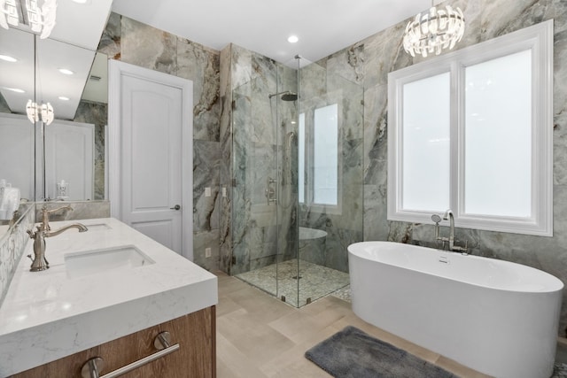 2305 Barton Creek Blvd Unit 36, Austin, TX 78735 - bathroom featuring a marble finish shower, a freestanding bath, double vanity, and recessed lighting