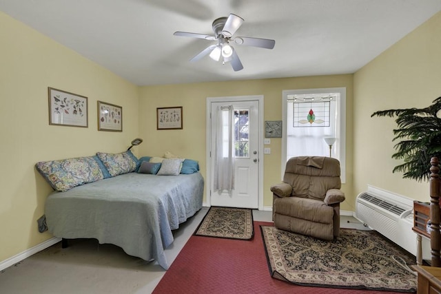 bedroom with a wall mounted AC, baseboards, and a ceiling fan